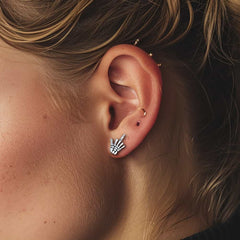 Brincos de pino punk esqueleto de dedo médio